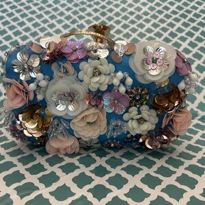 BEBE Floral Embellished Blue Clutch